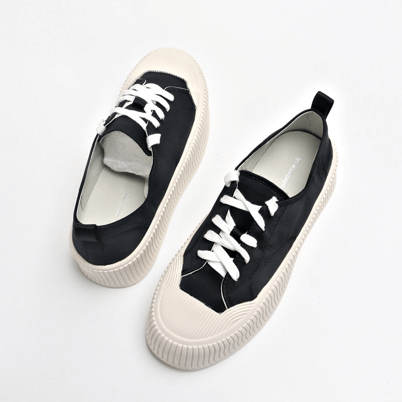 Women's black lace-up sports shoes with thick white soles, SF1008 model, offering comfort and durability for casual occasions.